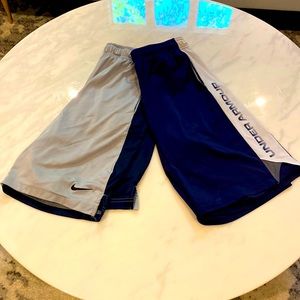 Nike Gray athletic shorts and Under Armour navy athletic shorts.